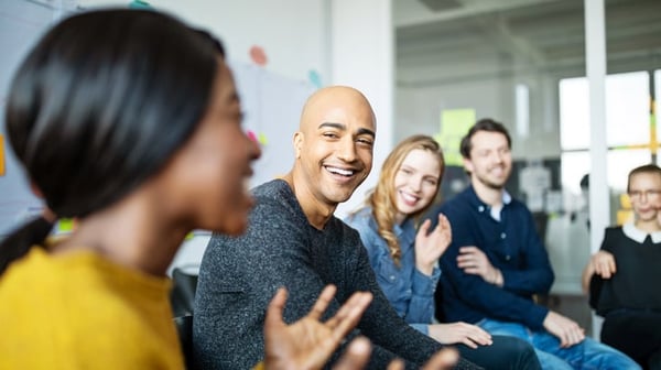 Diverse workers talking